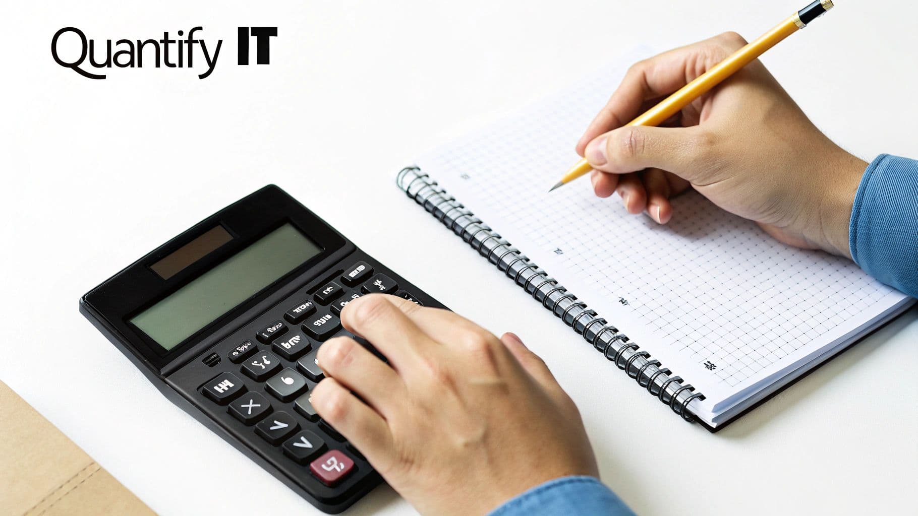Hands using a calculator and writing in a graph paper notebook on a white desk with 'Quantify IT' logo.