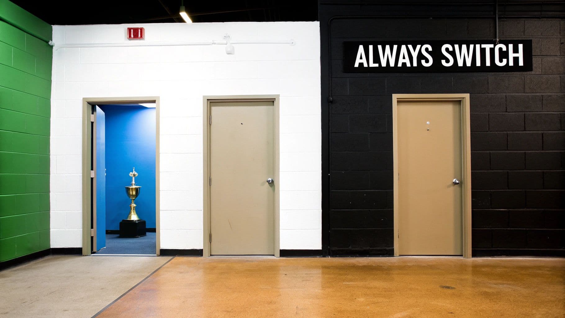 Three doors in a hallway, one open revealing a golden trophy, with an 'ALWAYS SWITCH' sign.